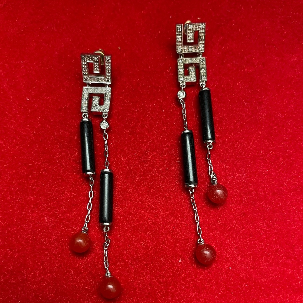 Sterling silver and jade earrings.